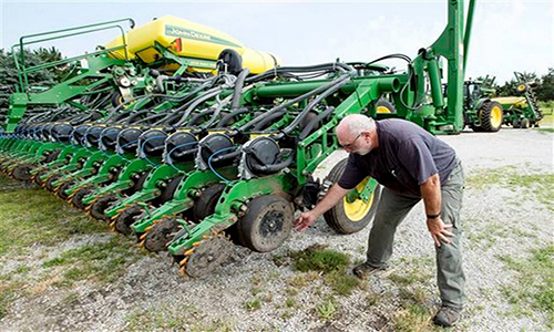 Farmer Mick Minchow takes a look at the fine components of his John Deere planter on Monday, June 20, 2016, at his farm in Waverly, Neb. Lincoln Journal Star via AP Kristin Streff