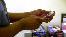 Nurse preparing vaccine inection