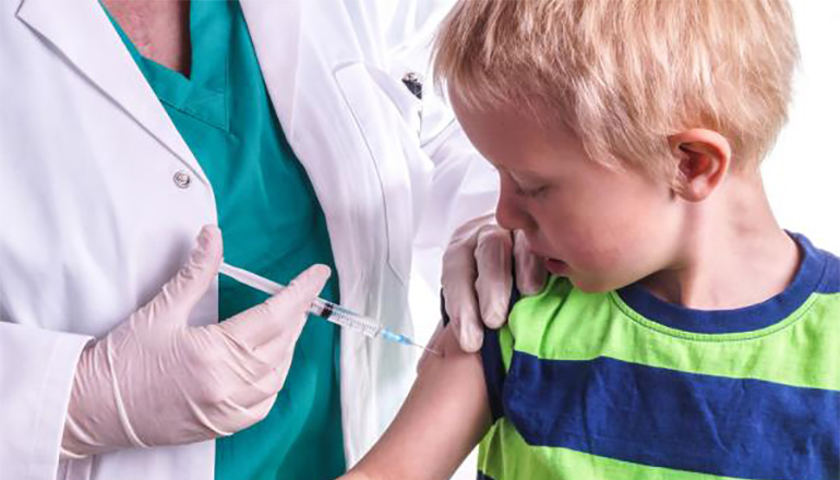 Doctor giving a child an injection