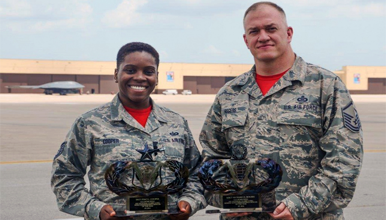 Tech. Sgt. Staci Cooper and Master Sgt. Richard Rogers proudly display their Air National Guard-level awards at Whiteman Air Force Base, Mo., July 7, 2017. Cooper and Rogers won the aviation resource management non-commissioned officer and senior non-commissioned officer of the year award for 2016.