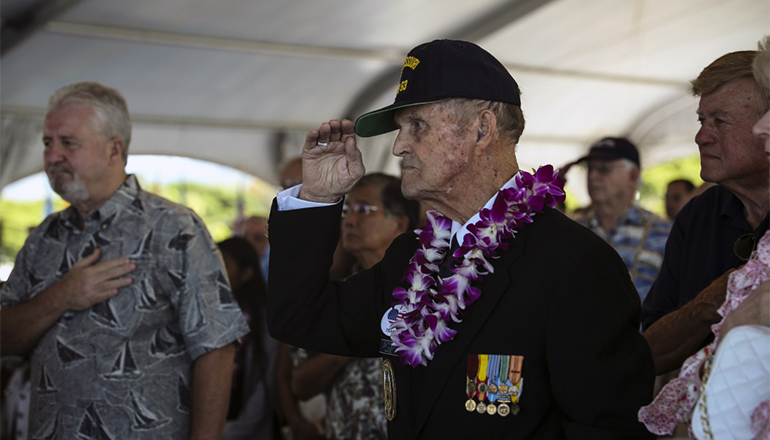 Former U.S. Navy Petty Officer 1st Class Art Albert salutes during the 72nd Anniversary of the End of World War II ceremony aboard the USS Battleship Missouri Memorial, Pearl Harbor, Hawaii, Sep. 2, 2017.