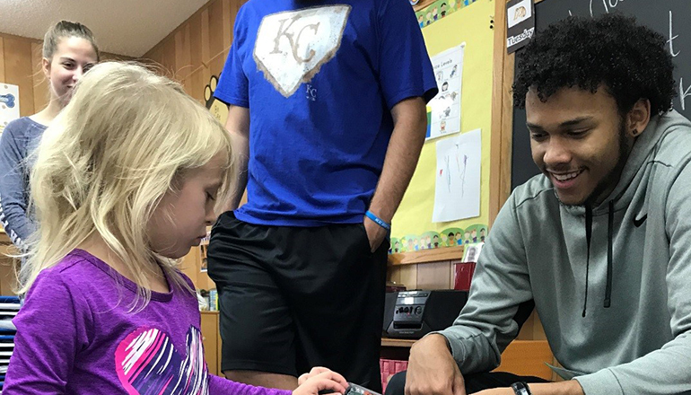 NCMC students enrolled in Human Growth and Development course recently visited Trenton Green Hills Head Start. Pictured is NCMC student MJ Johnson, awarding a Head Start student her prize for finding all of the alphabet letters.