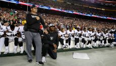 Some members of the Oakland Raiders kneel during the playing of the National Anthem before an NFL football game against the Washington Redskins in Landover, Md., Sunday, Sept. 24, 2017. (AP Photo/Alex Brandon)