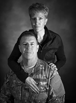 Susi Boudreaux and her husband, Col. John Boudreaux, have been married for over 28 years. On September 2016, John suffered an out-of-hospital cardiac arrest requiring quadruple heart bypass surgery, a situation less than one percent of victims live through. For months, Susi bathed, fed, and caretook for John as he was incapable from caring for himself. Now turning 53 this month, John wouldn't have been able to live without her.