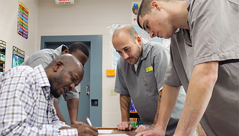 Prison inmates doing paperwork