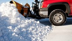 Pickup plowing snow