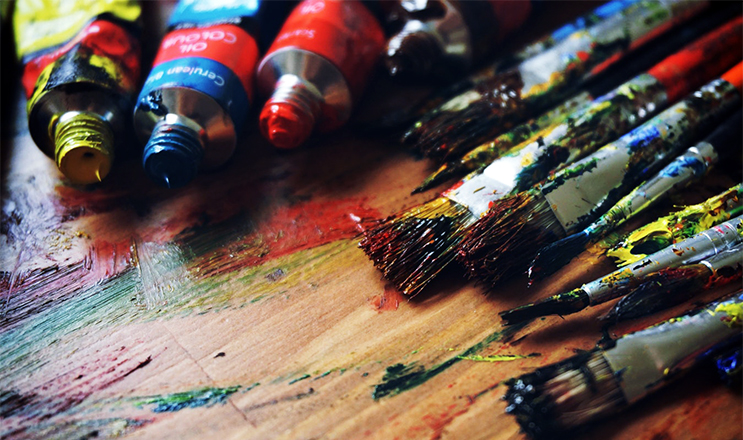 Arts or paintbrushes with paint for artists