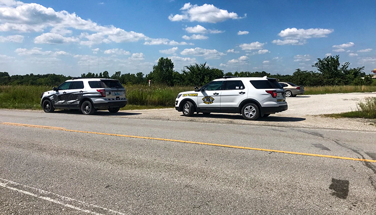 State Patrol Vehicles on Highway as authorities search for Diemel brothers