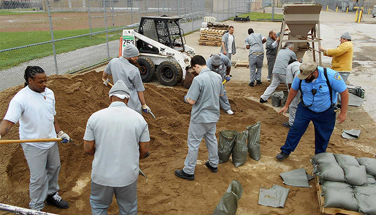 Offenders filling sand bags