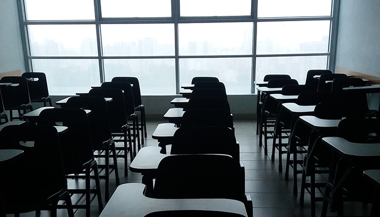 Desks in classroom of school or education or student