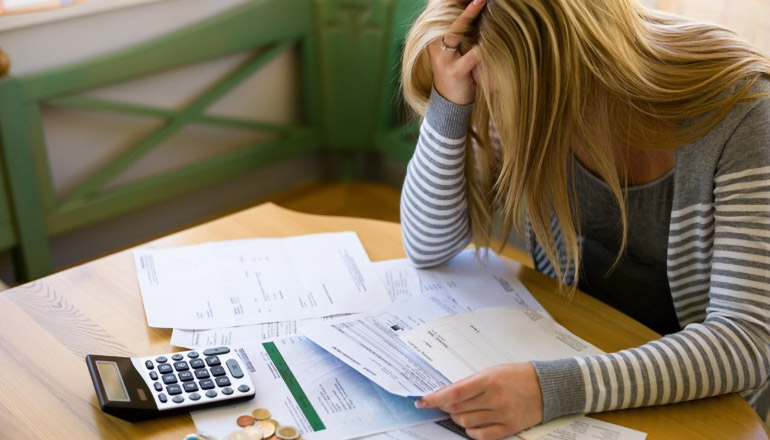 Woman struggling over finances (money)