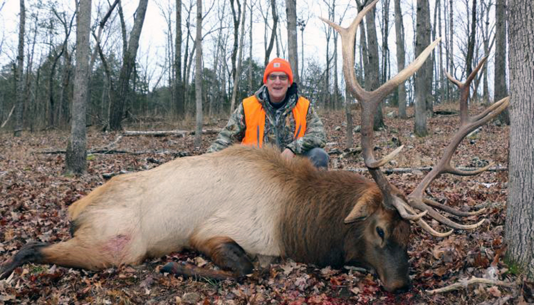 Gene Gulkey posing with elk he shot on December 16