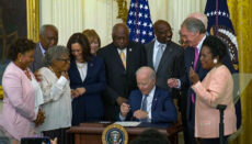 President Biden signs law making Juneteenth an official holiday (Photo is screenshot of Whitehouse video of signing event)
