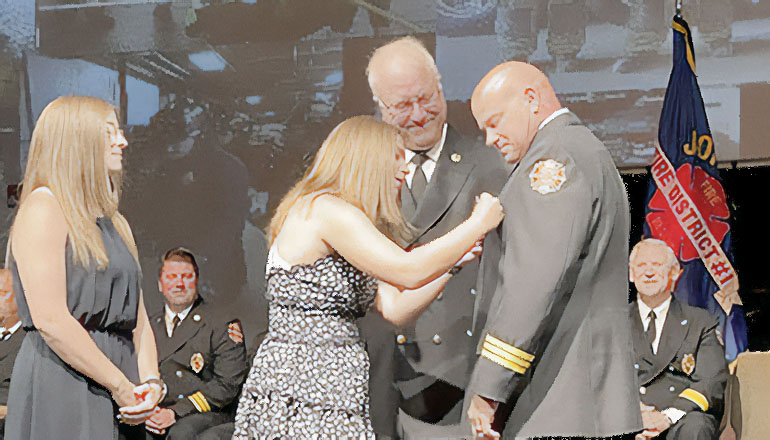 Deputy Fire Marshal of the Johnson County Fire District 1 Brad Ralston pinned