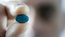 young man with a PrEP pill