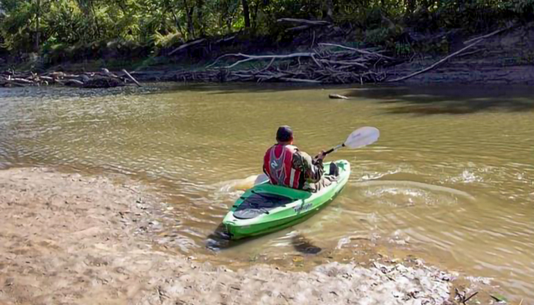 Person in Kayak on River enjoying float trip