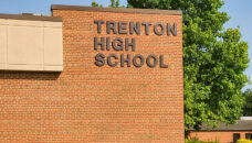 Photo of Trenton High School building with the sign "Trenton High School" or THS