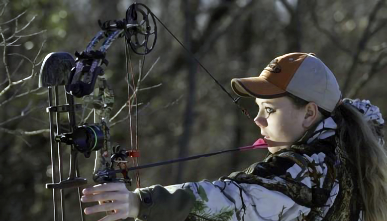 Girl holding bow and arrow