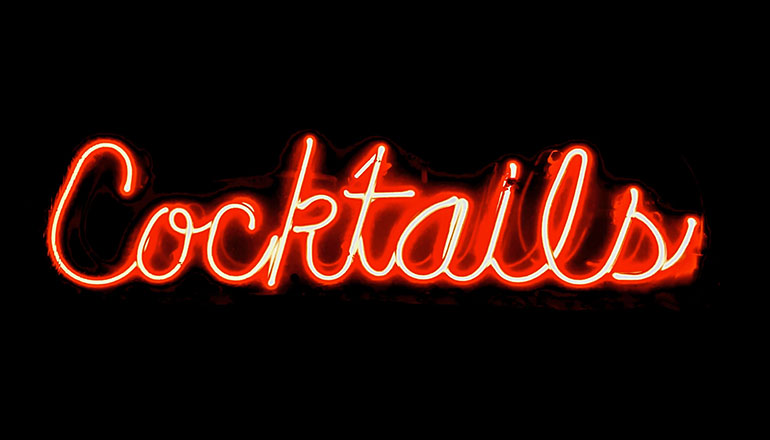 Neon red sign that says cocktails (liquor)