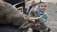 Jackson Boyer age 7 of Hillsboro with his first deer harvest in Adair County