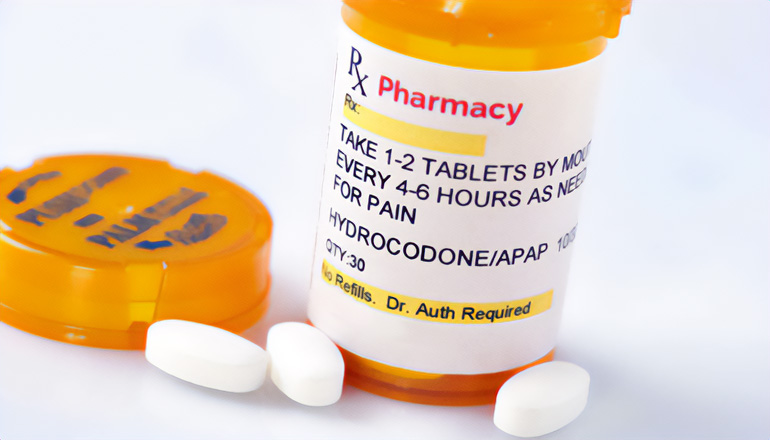 Hydrocodone tablets with prescription bottle