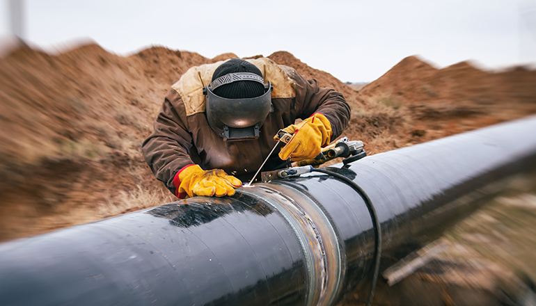 A welder completes a weld on a gas pipeline.(Photo courtesy of Missouri News Service)