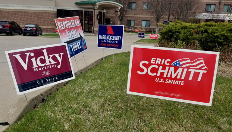 Yard signs for GOP Senate candidates greet Republicans attending Boone County Lincoln Days Friday in Columbia (Rudi Keller - Missouri Independent)
