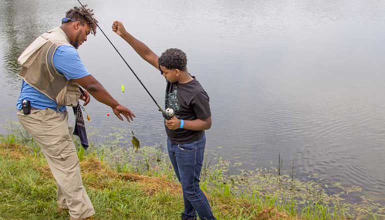 Man and boy fishing (Photo courtesy Bill Graham, Missouri Department of Conservation)