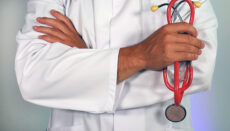 Doctor holding stethoscope or healthcare or medicine (Photo courtesy Online Marketing on Unsplash)