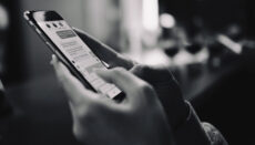 A person texting on a mobile device (Photo via Envato Elements)