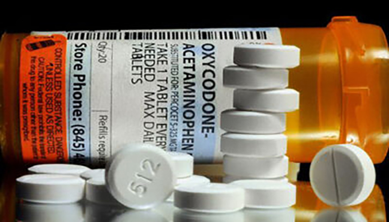 Oxycodone prescription or pill bottle with drugs