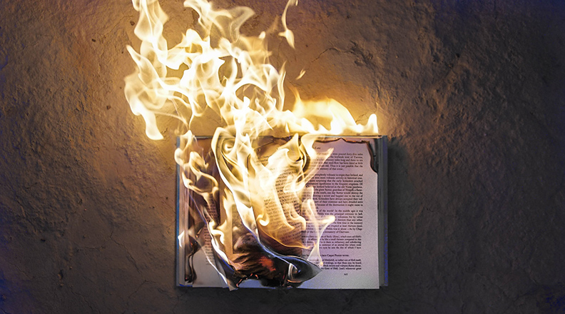 Burning or Banned Book (Photo by Freddy Kearney on Unsplash)