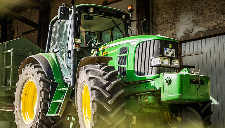 John Deere Tractor (Photo by Julia Koblitz on Unsplash)