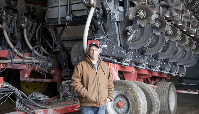 Lance Lillibridge is a farmer in Benton County in his machine shed at his farm on Dec. 17, 2022 (Photo by Emily Kestel for Investigate Midwest)