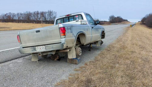 Pickup with stolen wheels back