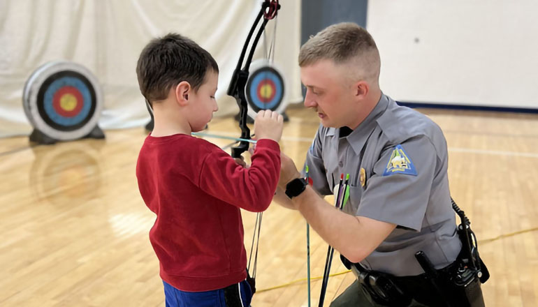 Conservation agent and child during family night