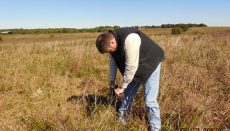 Man taking soil sample for soil test