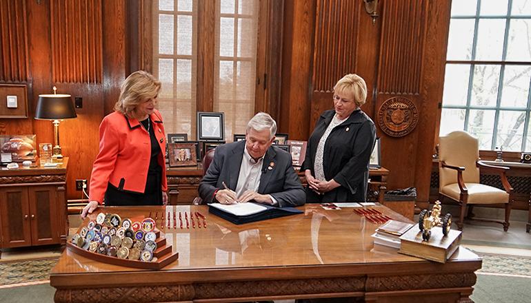 Governor Parson signs SB 51 into law (Photo courtesy Missouri Governor's office)