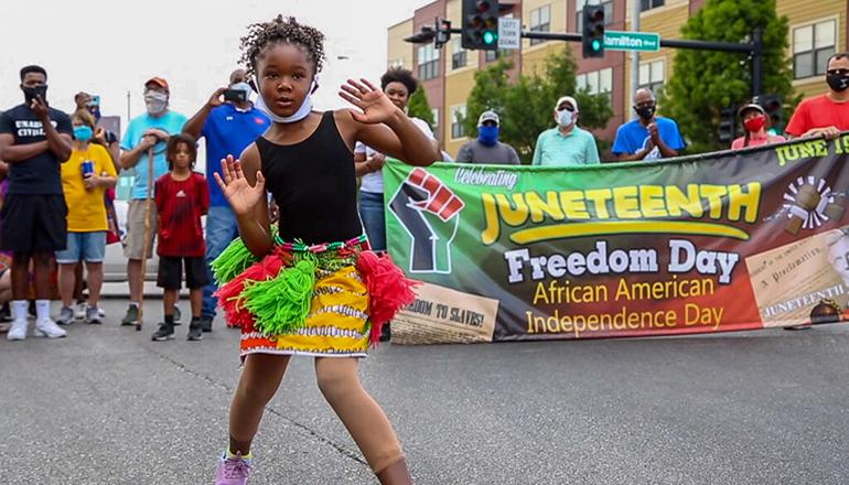A dancer performs at the Juneteenth Racial Injustice Solidarity March in St. Louis on June 19, 2020 (Photo by Rebecca Rivas - Missouri Independent)