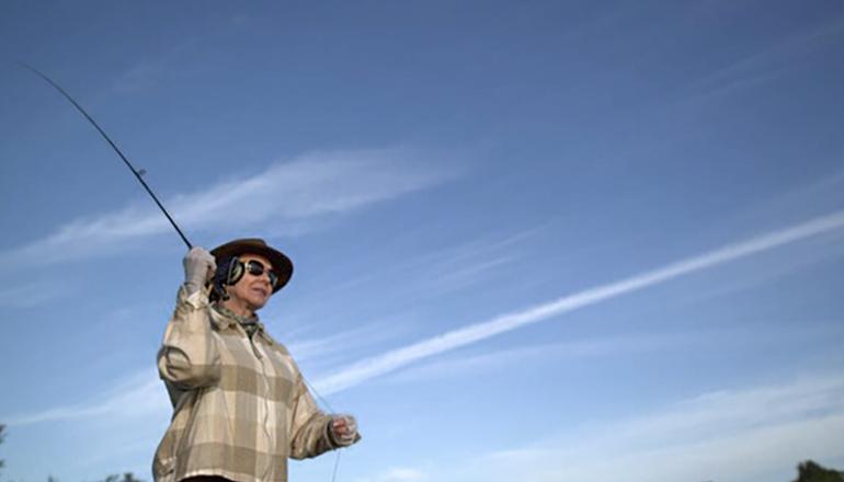 Woman fly fishing