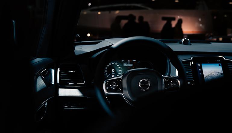 black driver side interior of empty car (Photo by louis tricot on Unsplash)