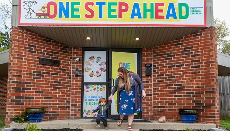 Sixteen-month-old Finn Marmaud leaves daycare with his mother (Photo by Erin Woodiel - Missouri Independent)