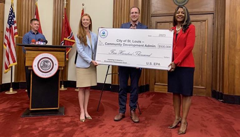 EPA Region 7 Administrator Meg McCollister presents a $500,000 ceremonial check to the Community Development Administration (CDA) of St. Louis, Missouri,
