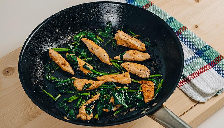 Chicken cooking in a pan (Photo by Behnam Norouzi on Unsplash)