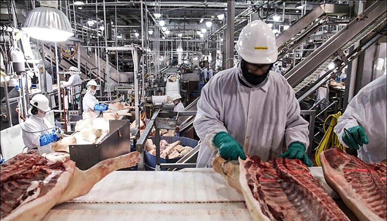 Workers at meat processing plant (Photo courtesy United States Government Accountability Office via Wikipedia)