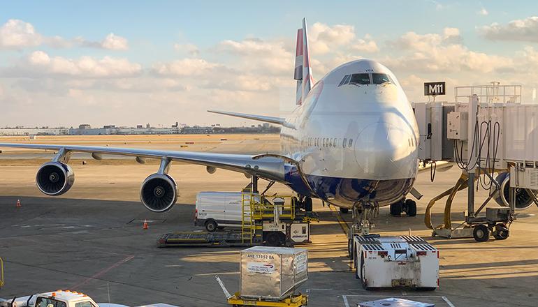 747 aircraft at terminal or jetway ( Photo by Patrick Campanale on Unsplash)